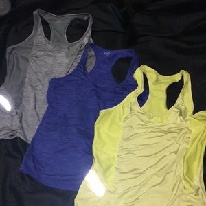 Three Athleta racerback workout tees